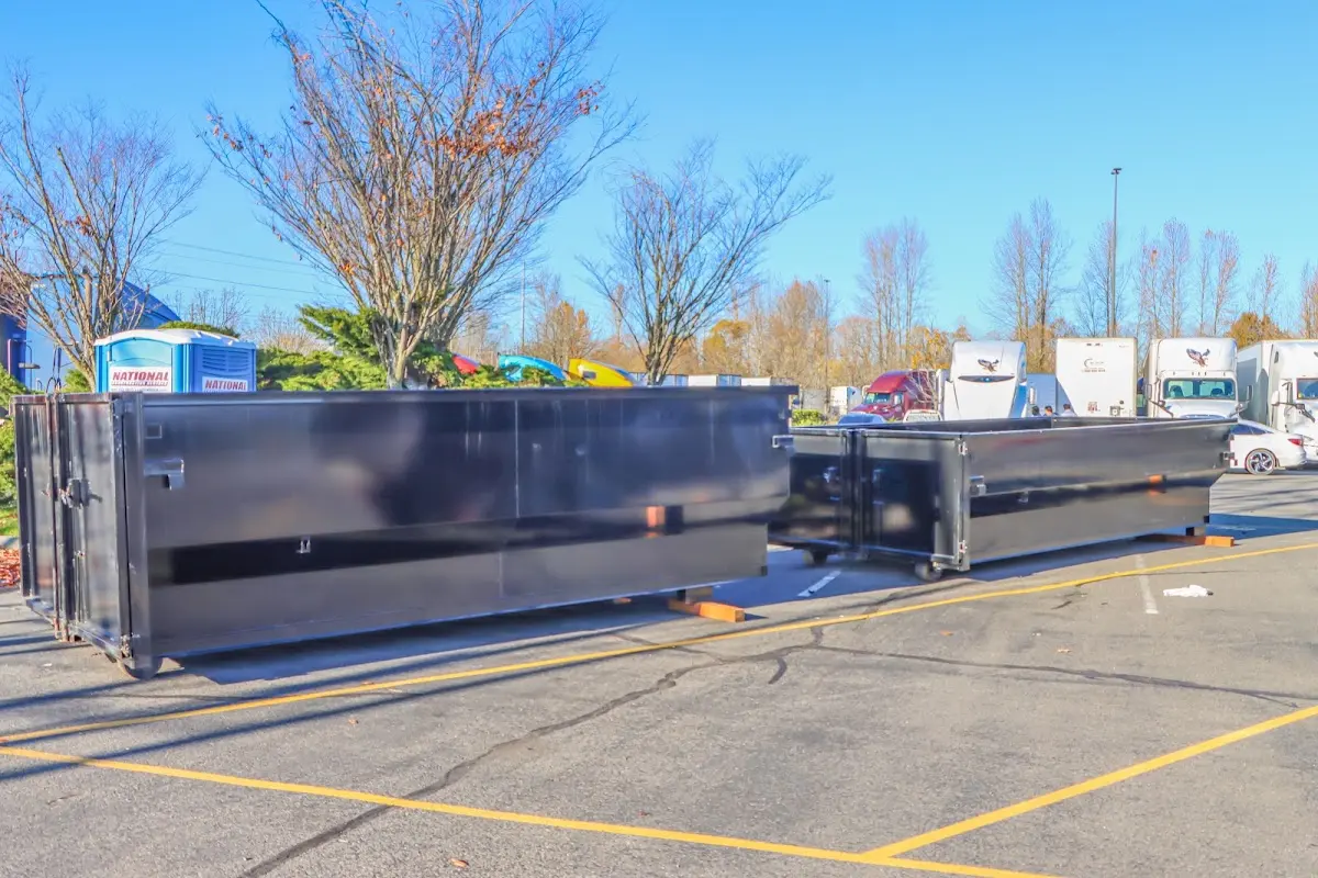 Professional dumpster rental service with roll-off container on residential driveway in Lodi